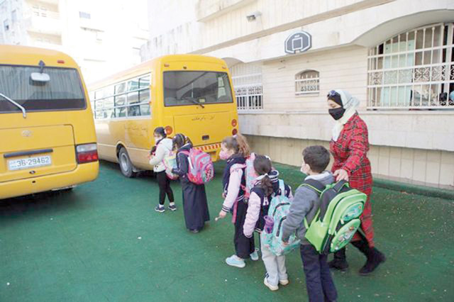 Students are seen waiting to board a school bus in Amman in this photo taken on February 7, 2021 (JT file photo)