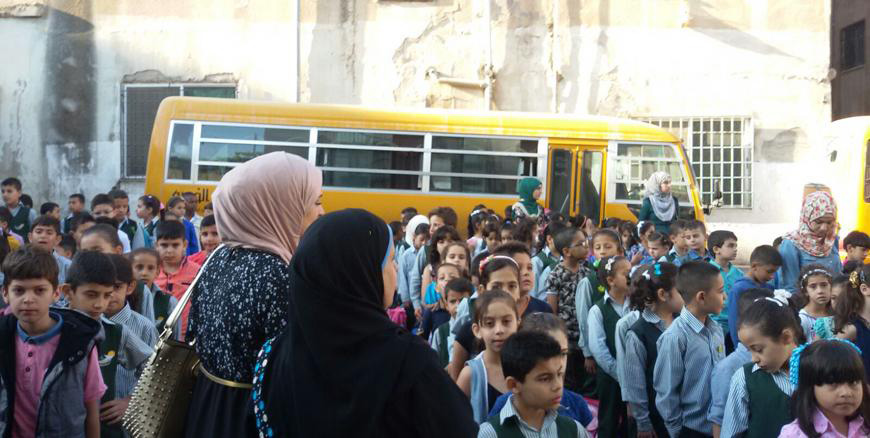 Teachers at a private school attend to the morning assembly in Irbid (File photo)