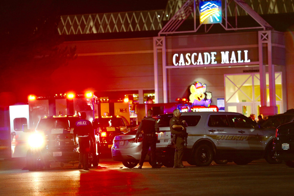 Law enforcement officers work at the crime scene outside of Cascade Mall in Burlington, Washington, where several people were fatally shot on Friday (AP photo)