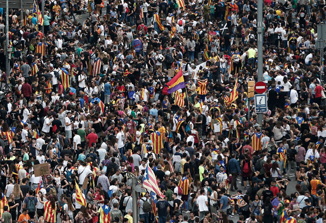 People gather to stage a demonstration within the general strike, supporting Catalonian independence and reacting against Spanish police's intervention in polling centres, in Barcelona, Spain, on Tuesday (Anadolu Agency photo)