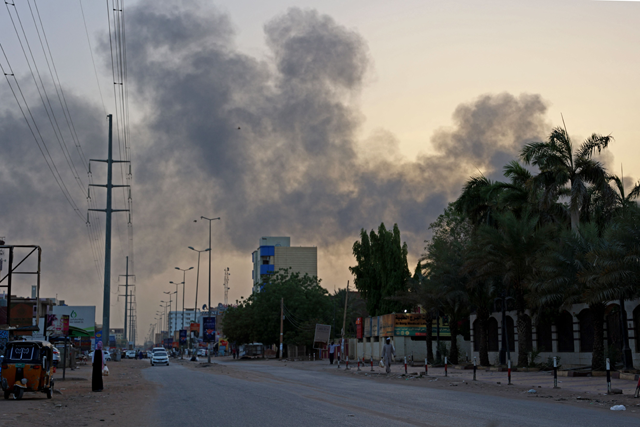Smoke billows above residential buildings in east Khartoum on Sunday, as fighting in Sudan raged for a second day in battles between rival generals (AFP photo)