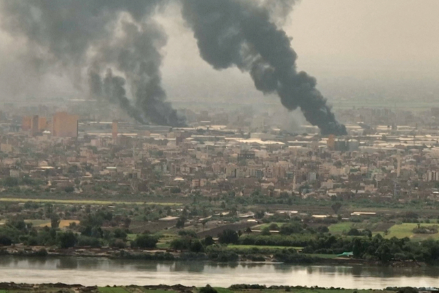This image grab taken from AFPTV video footage on Friday, shows an aerial view of black smoke rising over Khartoum (AFP photo)