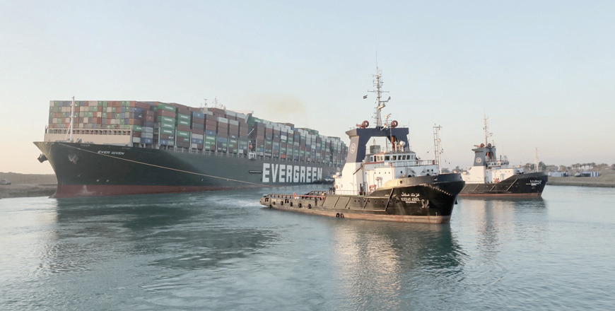 This handout photo released by the Suez Canal Authority on Monday shows tugboats pulling the Panama-flagged MV 'Ever Given' (operated by Taiwan-based Evergreen Marine) container ship, a 400-metre-long and 59-metre-wide vessel, lodged sideways impeding traffic across Egypt's Suez Canal waterway (AFP photo)