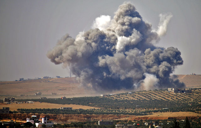 Smoke rises above rebel-held areas of the city of Daraa, during reported airstrikes by Syrian regime forces on Thursday (AFP photo)