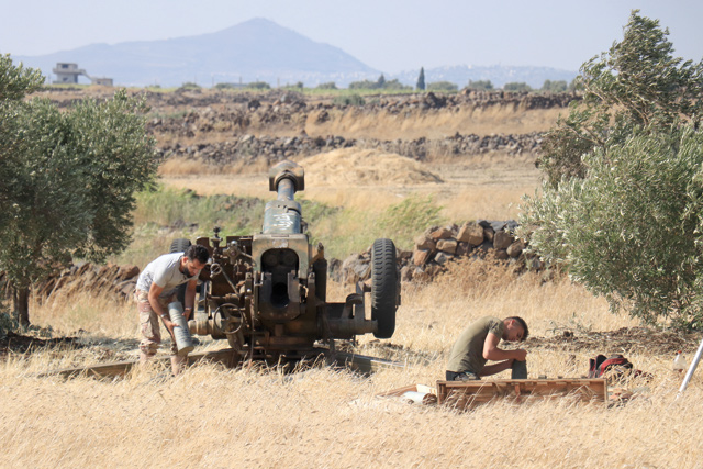 Syrian armed opposition groups attack Assad regime forces’ positions from the opposition controlled Quneitra located at Israeli border on Monday in Quneitra, Syria (Anadolu Agency photo)