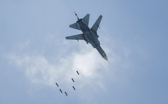 A Syrian government forces’ MiG-23 fighter-bomber drops a payload during a reported air strike in the rebel-held area of Qabun, east of the capital Damascus, on Saturday (AFP photo)