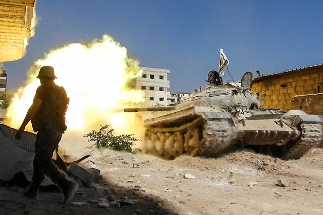 Opposition forces' tank fires during a clash after Assad Regime's forces hit a de-conflict zone of opposition controlled Jobar neighbourhood, in Damascus, Syria, on Wednesday (Anadolu Agency)