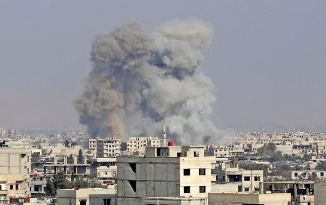 Smoke rises after air strikes over Madyarah town of the Eastern Ghouta region in Damascus, Syria, on Monday (Anadolu Agency  photo)