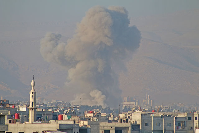 Smoke rises after air strikes over Arbin town of the Eastern Ghouta region in Damascus, Syria, on Saturday (Anadolu Agency photo)