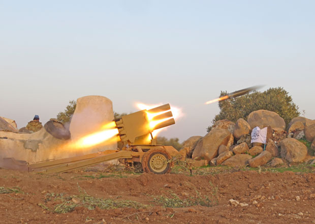 Multi-barrel rocket launcher in action within the clashes between armed opposition group Tahrir Al Sham and Assad regime forces around the Abu Al Duhur military airbase in a de-escalation zone in Idlib, Syria, on Saturday (Anadolu Agency photo)