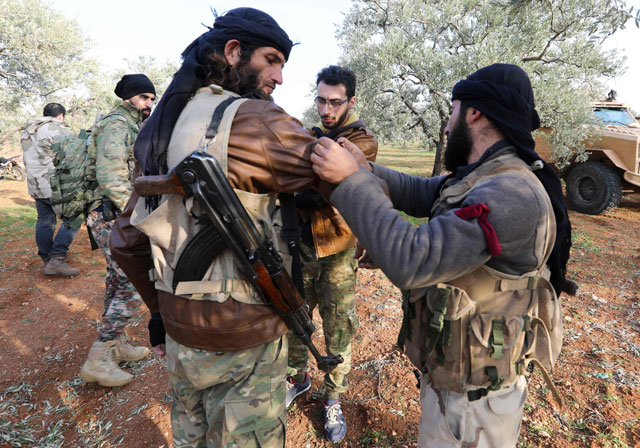 Opposition fighters prepare to head towards the frontline near the village of Al Khuwayn during ongoing battles with government forces in Syria's Idlib province on Saturday (AFP photo)