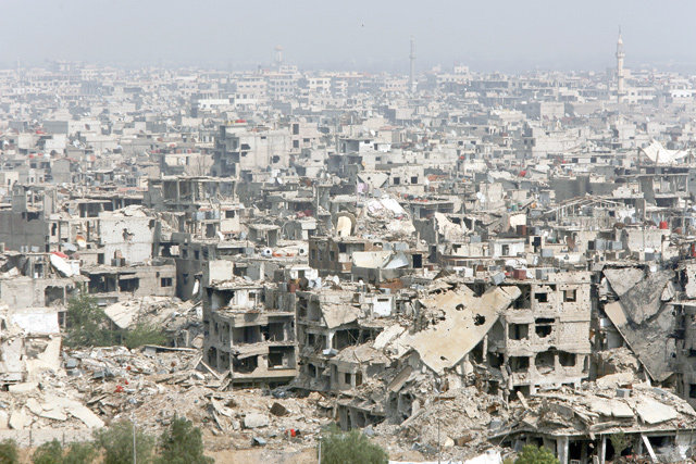 Damaged buildings are seen at the Yarmouk Palestinian camp in Damascus, Syria, on Saturday (Reuters photo)