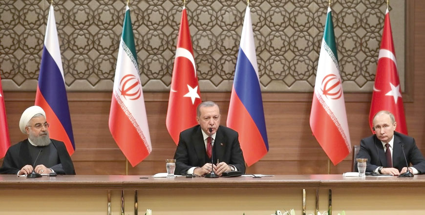 Iran's President Hassan Rouhani, Turkey's President Recep Tayyip Erdogan and Russia's President Vladimir Putin hold a joint press conference during a tripartite summit on Syria, in Ankara, on Wednesday (AFP photo)
