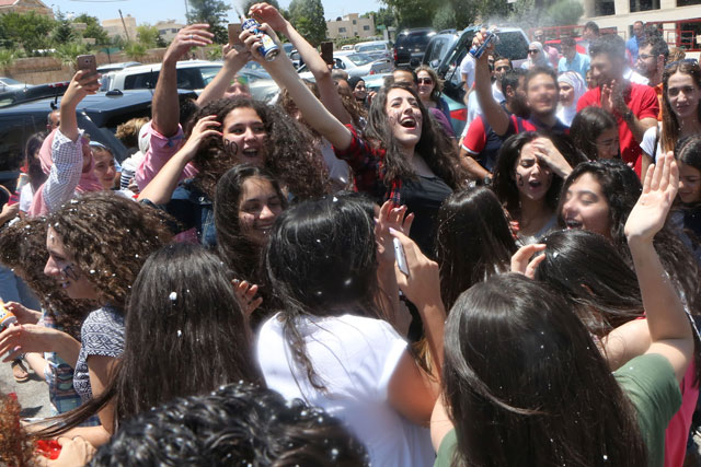 Tawjihi graduates celebrate success in  Amman as results were out on Sunday (Photo by Osama Aqarbeh)