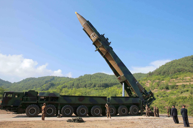 This photo taken and released on Tuesday by North Korea's official Korean Central News Agency shows North Korean leader Kim Jong-un (2nd right) inspecting the test-fire of the intercontinental ballistic missile Hwasong-14 at an undisclosed location (AFP photo)