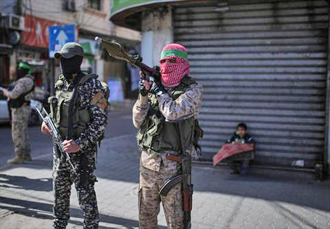Members of the Ezzeddin Al Qassam Brigades, the armed wing of Palestinian group Hamas, launch military exercises in the Gaza Strip on Sunday after Israeli warplanes struck a Hamas position in the southern Gaza Strip (Anadolu photo)