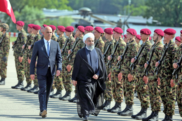 President of Iran Hassan Rouhani (right) is welcomed by President of the Swiss Confederation Alain Berset at Zurich Airport in Zurich, Switzerland, on Monday  (Anadolu Agency photo)