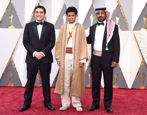 Director Naji Abu Nowar and actors Jacir Eid and Hassan Maraaiah pose for a photo on the Oscars red carpet in Los Angeles on Sunday night  (Photo courtesy of Bayt Al Shawareb/Noor Pictures/Immortal Entertainment)