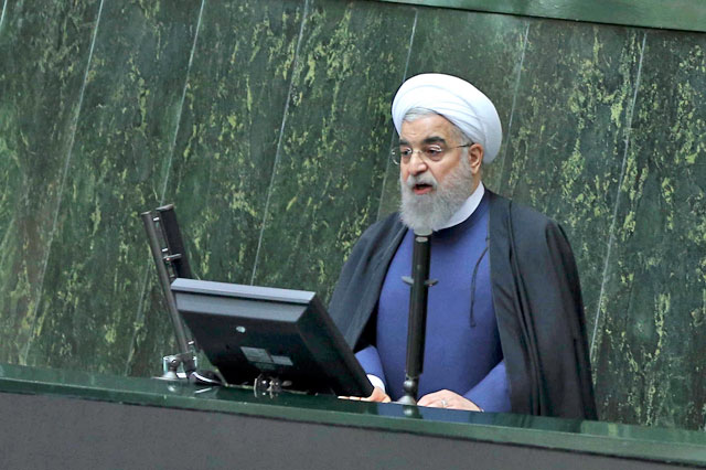 Iranian President Hassan Rouhani speaks while submitting his budget bill for next year in an open session of parliament in Tehran on Sunday (AP photo)