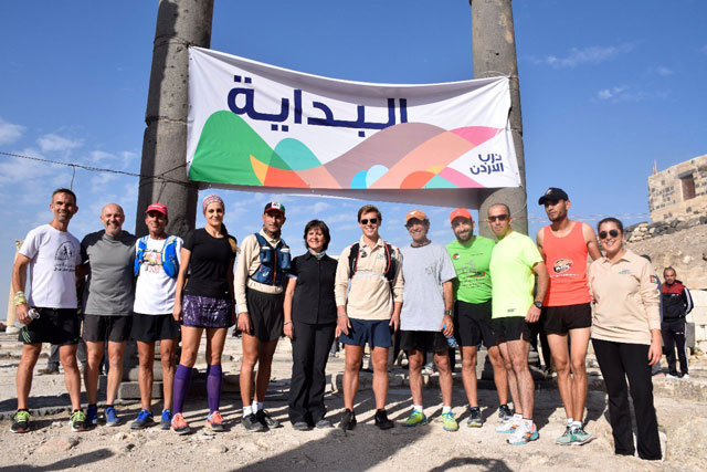 Tourism Minister Lina Annab poses for a group photo with athlete Mohammad Al Sweity and British runner Alfie Pearce-Higgins on the first day of their Jordan Trail 15-day run on Friday (Photo courtesy of the Jordan Trail Association)