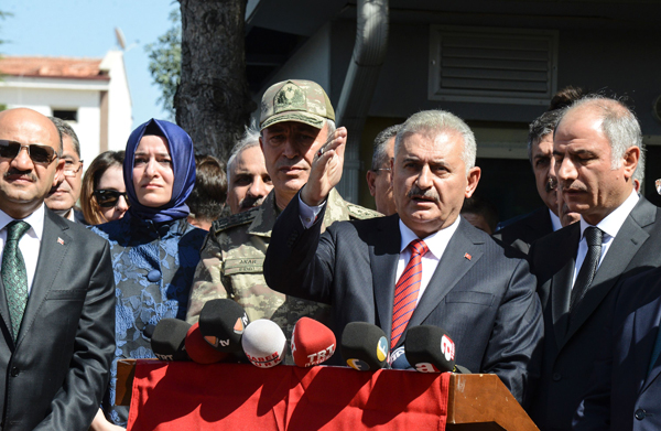 Turkish Prime Minister Binali Yildirim (centre) gives a press conference after inspecting the blast scene following a car bomb attack on a police station in the eastern Turkish city of Elazig, on Thursday (AFP photo)