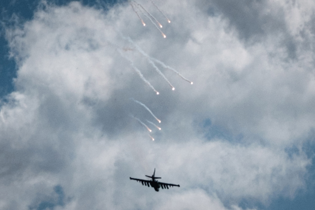 A Ukrainian Sukhoi Su-25 releases decoy flares as it provides an air support to Ukrainian troops on the ground during the battle near Yampil, eastern Ukraine, on Wednesday, amid Russian invasion of Ukraine (AFP photo)