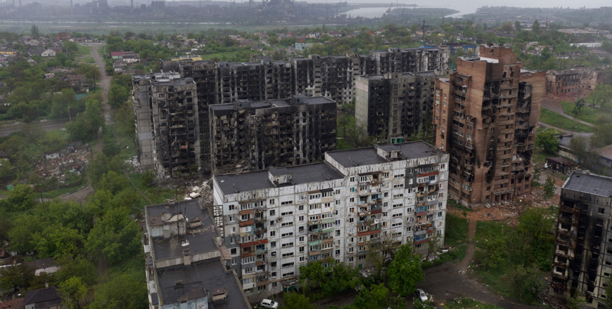 An aerial view of damaged residential buildings and the Azovstal steel plant in the background in the port city of Mariupol on Wednesday, amid the ongoing Russian military action in Ukraine (AFP photo)
