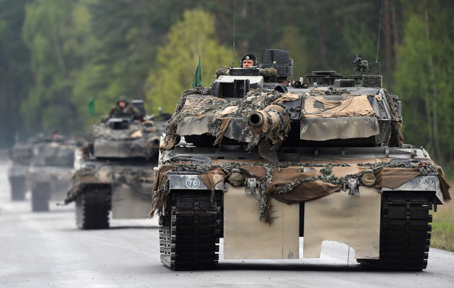 This file photo taken on May 12, 2017, shows German soldiers on Lepard tanks arriving for a friendship shooting of several nations during the exercise 'Strong Europe Tank Challenge 2017' at the military training area in Grafenwoehr, near Eschenbach, southern Germany (AFP photo)