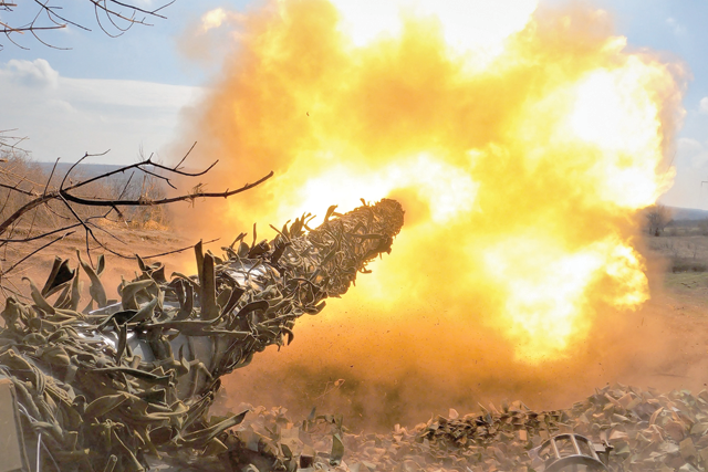 This photograph taken on Sunday, shows an Ukrainian T-72 tank fires at Russian positions on the front line near Bakhmut, amid the Russian invasion of Ukraine (AFP photo)
