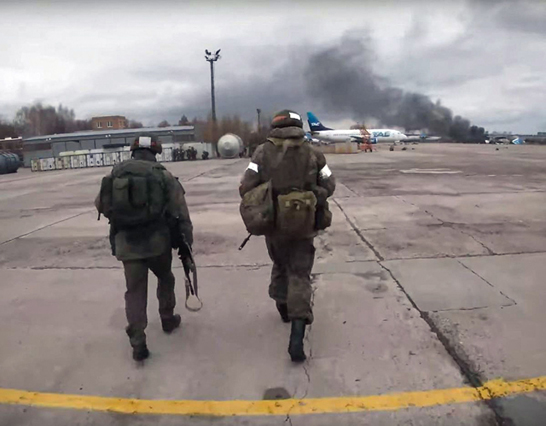 This video grab taken from a handout footage released by the Russian Defence Ministry on Friday shows Russian paratroopers taking control of an undisclosed airfield in Ukraine, according to the Russian Defence Ministry (AFP photo)