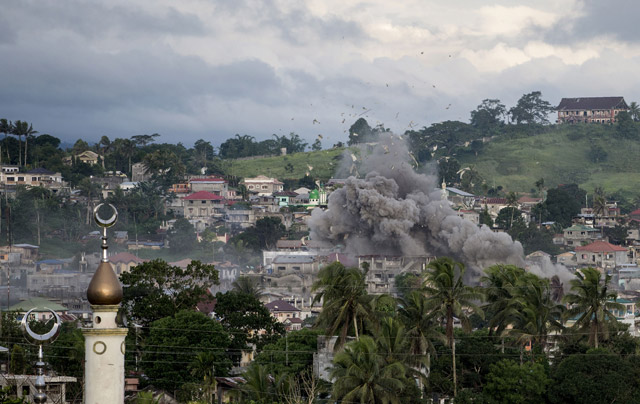A bomb explodes after being dropped on an Islamist fighters, hideout in Marawi, on the southern Philippine island of Mindanao, on Friday (AFP photo)