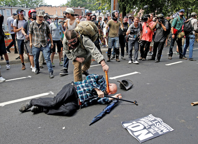 Counter demonstrators attack a white supremacist during a rally in Charlottesville, Virginia, the US, on Saturday (Reuters photo)