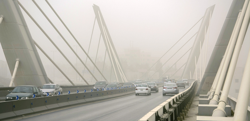 Dust engulfs Abdoun Bridge in Amman on Tuesday (Photo by Amjad Ghsoun)