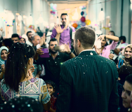 Mutaz Mango and Basma Omar celebrate their wedding among refugees at an old hotel in downtown Amman recently (Photo courstesy of Youssef Kawar)