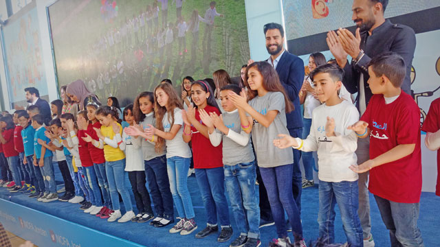 Children and Jordanian pop stars sing songs about children’s rights at the World Children’s Day celebration in Amman on Monday (Photo by Ana V. Ibáñez Prieto)