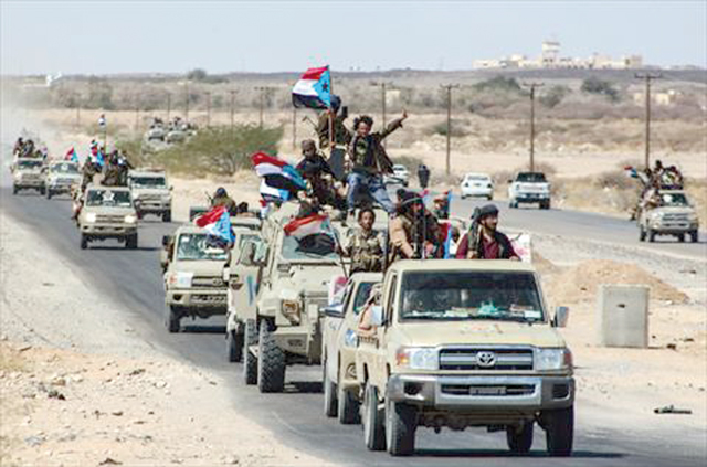 Yemeni pro-government fighters from the UAE-trained Giants Brigades gather on the outskirts of Ataq city, east of the Red Sea port of Aden, on their way to the frontline facing pro-Iran Houthi fighters, on Friday (AFP photo)