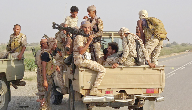 Forces loyal to Yemen's Saudi-backed government enter the Abs district of the northwestern Hajjah province on March 11, 2021 (AFP photo)