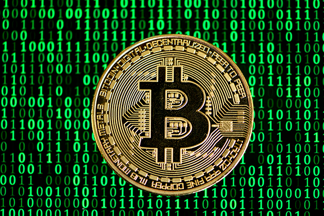 The photo shows a physical imitation of a Bitcoin in Dortmund, western Germany, on January 27 (AFP photo)