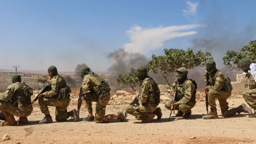Syrian rebel fighters from the recently-formed ‘National Liberation Front’ take part in military training at an unknown location in the northern countryside of the Idlib province on Tuesday (AFP photo)