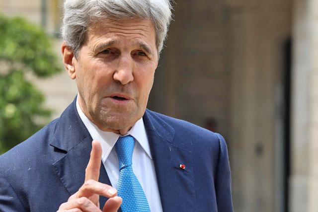 Former US secretary of state John Kerry speaks to the press while leaving the Elysee Palace in Paris after the ‘Tech for Good’ summit on May 23 (AFP photo)