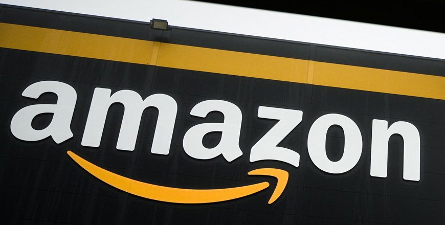 This photo taken on October 22, 2019, shows the logo of Amazon on a new warehouse, part of mobile robotic fulfilment systems also known as 'Amazon robotics', in Bretigny-sur-Orge, some 30kms south of Paris (AFP photo)