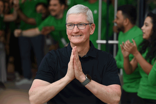 Chief Executive Officer of Apple Tim Cook gestures during the opening of Apple's first retail store in India, in Mumbai on Tuesday (AFP photo)