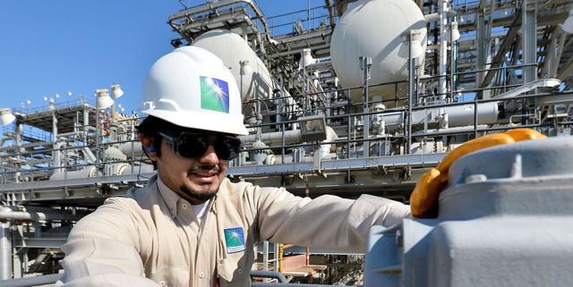 At work: An engineer at Saudi Arabian state-owned oil and gas company Aramco's Yanbu refinery (AFP file photo)