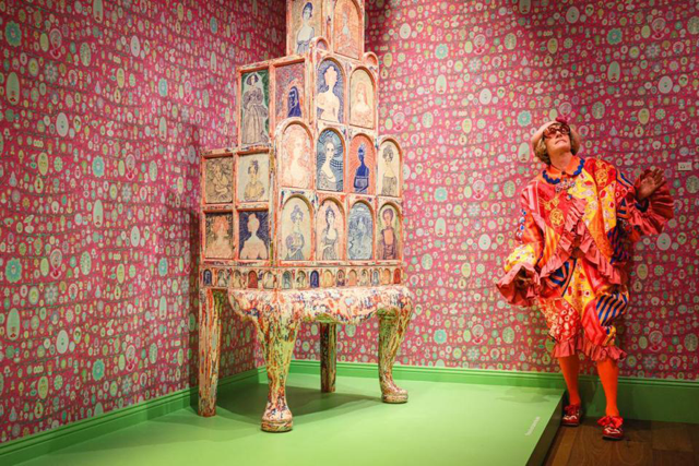 Grayson Perry poses for a photograph beside ‘The Great Beauty’, a piece made from oak, brass and ceramics, during a photocall for ‘Grayson Perry: Delusions of Grandeur’ at The Wallace Collection in London (AFP photo)