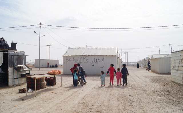 Syrian refugees are seen in the Azraq camp around 100km from Amman, in the Eastern desert (Photo by Hanna Davis)
