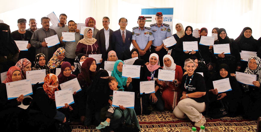 Graduates of the UN’s Entity for Gender Equality and the Empowerment of Women’s Skills Building Programme and Japanese Ambassador to Jordan Hidenao Yanagi pose for a photo on Wednesday (Photo courtesy of UN Women)