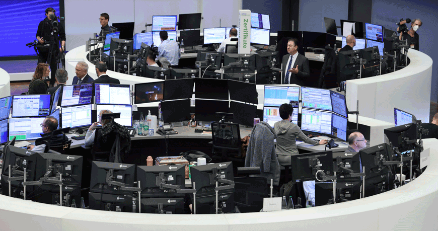 Traders work at the stock exchange in Frankfurt am Main, western Germany, on Monday  (AFP photo)