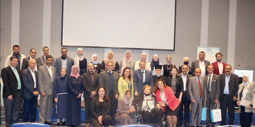 Attendees pose for a group photo during the release of the results of a study to evaluate elderly nursing homes in Jordan on Monday (Photo courtesy of NCFA)