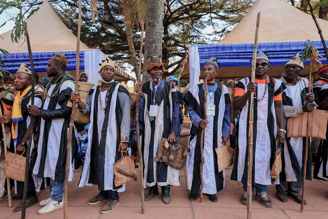 People's deputies (Fonan Nguon) look on as they stand in the courtyard of the palace of the Bamoun Kings during the 548th edition of the Nguon festival of the Bamoun people in Foumban on December 7 (AFP photo)
