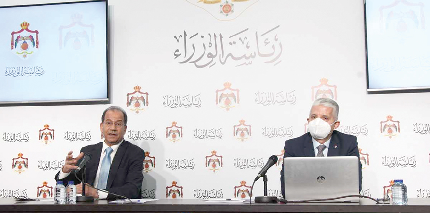 Minister of Media Affairs Faisal Shboul and National Cyber Security Centre President Ahmad Melhem hold a press conference at the Prime Ministry on Sunday (Petra photo)